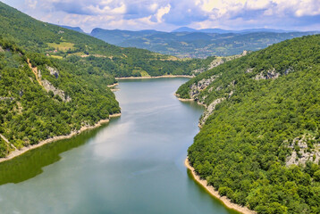 Obraz na płótnie Canvas Aerial view over lake Bocac near city of Banja Luka in Bosnia and Herzegovina during sunny spring day.