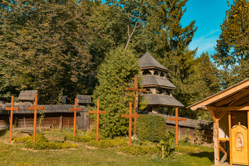 rural country side space summer clear weather day time scenic view with wooden church and cemetery...