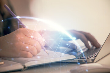 Double exposure of woman hands typing on computer and social network theme hologram drawing. People media concept.