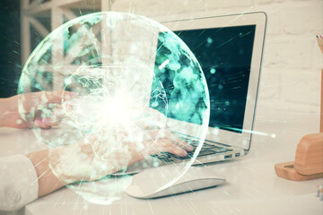 Double exposure of woman hands typing on computer and business theme hologram drawing. Success concept.