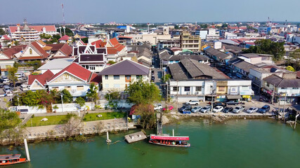 Aerial view of Maeklong railway market and city skyline, Thailand