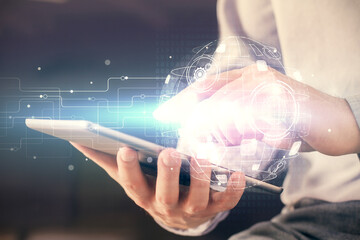 Double exposure of man's hands holding and using a phone and social network theme drawing.