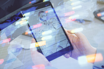 Multi exposure of man's hands holding and using a digital device and data theme drawing. Innovation concept.