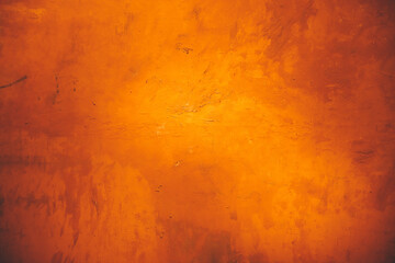 Horizontal yellow and orange grunge texture cement or concrete wall banner, blank background
