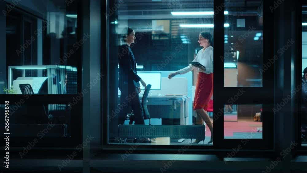 Aufkleber footage from outside: two businesswomen meet and shake hands in office. managers standing by the win