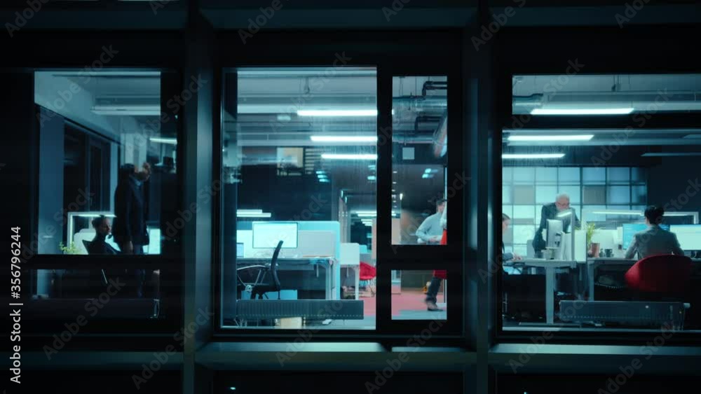 Poster footage from outside: two business partners meet and use a tablet in office. managers standing by th