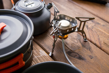 tourist gas burner and utensils standing on the table