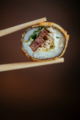 sushi with chopsticks