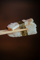 sushi with chopsticks