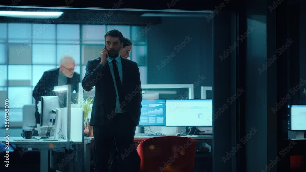 Aufkleber footage from outside: businessman talking on a mobile in the office. manager is having a business ca