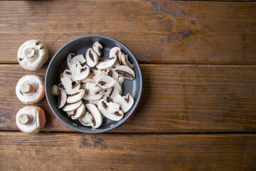 Obraz na płótnie Canvas sliced mushrooms lie in a pan