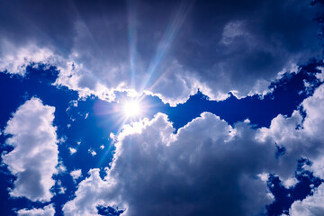 Uva and uvb rays of the sun pass through the atmosphere and the clouds to the skin of people.