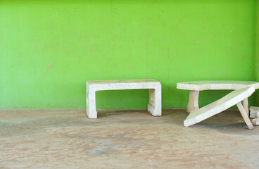 living room crumbles beside the green wall.