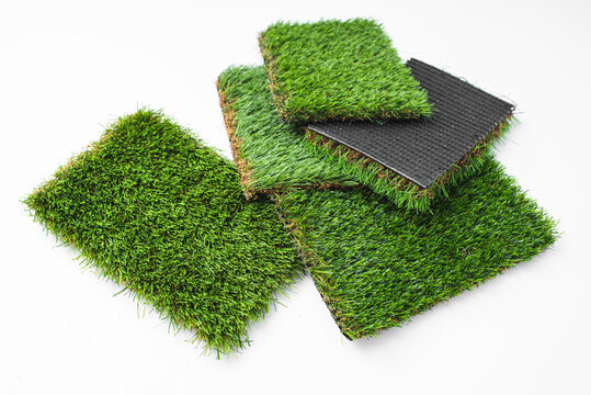 Detail of types of artificial grass in a sample book.