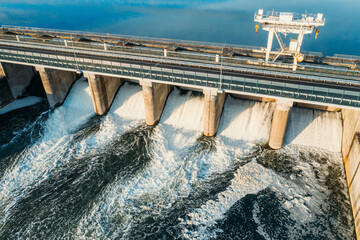 Hydroelectric Dam gates, hydro power station on river, aerial view from above. - obrazy, fototapety, plakaty