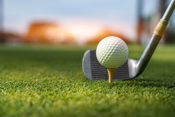 Golf club and white golf ball on green grass for golfer training ,Let's golf
