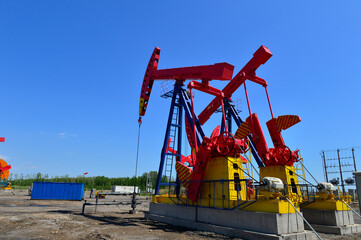 Fototapeta na wymiar Oil pump working in the outdoor scene