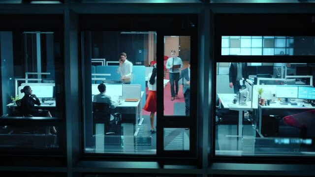 Elevating Footage from Outside the Window: Businessmen and Businesswomen Working in the Office. Managers Doing Financial Tasks and Errands. Employees Work on Computers, Laptops, Mobile Phones, Tablets