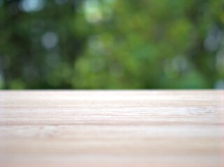 Empty wood table top on blur flowers garden background ,nature abstract blurred, display product, balnk table	