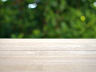 Empty wood table top on blur flowers garden background ,nature abstract blurred, display product, balnk table	