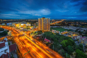 CHIANG MAI, THAILAND - June 6,2020:  Time lapse Aerial view Chiang Mai City skyline with dramatic rain clouds, Thailand