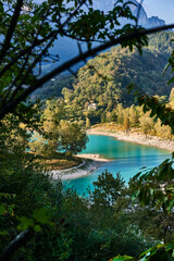 Fototapeta na wymiar Lake Tenno with mountain reflection in water.Trento,Italy, Europa. Turquoise lake in the mountains
