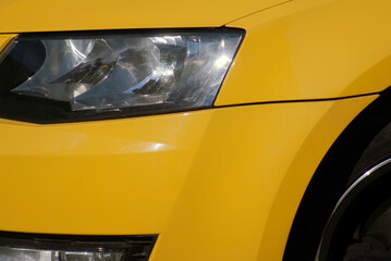 headlight of a yellow car