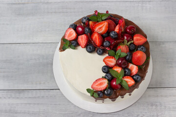Sponge cake with chocolate ganache and fresh fruits.