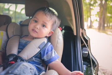 baby in car seat while traveling with family