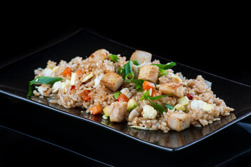 A plate of food with rice and vegetables