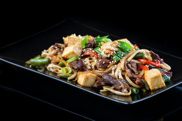 A plate of food with rice and vegetables