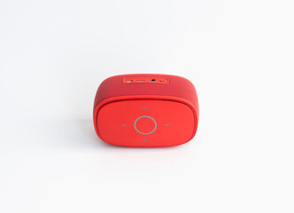 Red bluetooth speaker on white background.
