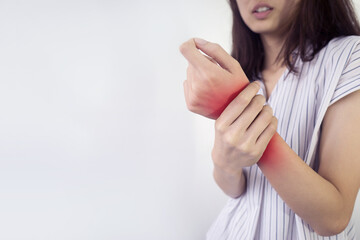 Close up woman suffering from pain in hand or wrist.