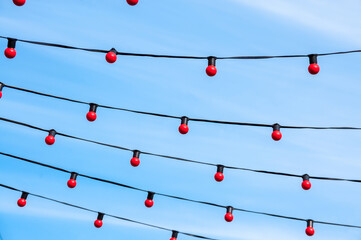 Background, red lamps on a blue sky background