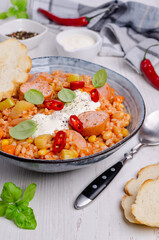 Stewed rice with beans, sausages and vegetables