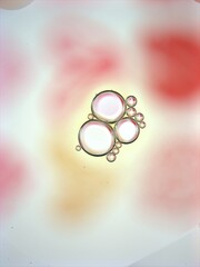 Beautiful bubbles oil with colorful white pink background ,dropslets macro image ,abstract background, sweet pastel color for card design, valentine day