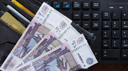 Lot with Russian rubles is on the wallet with credit cards.Paper banknotes Russian Rubles.Rubles is...