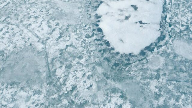 Aerial view of cracked ice floes. Global warming, climate change winter background