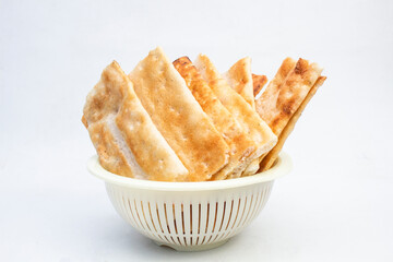 Opak ketan is a Indonesian Crispy Dry Snack Similar To Crackers. There are Sweet, Salty and Original Ones. Usually Used As A Daily Meal and During Eid al-Fitr. 