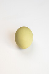 Multicolored village chicken eggs on a white background