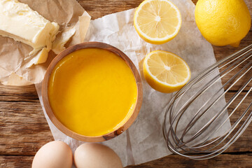 classic recipe for hollandaise sauce close-up with ingredients eggs, lemon, butter. horizontal top view