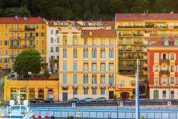 Yellow colorful apartment buildings at Port Lympia in Nice, France