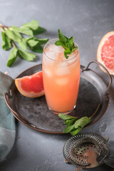 Fresh grapefruits and glass of grapefruit juice