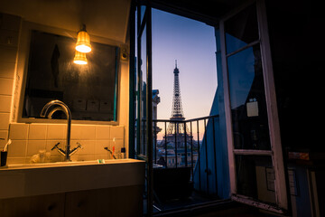 Window view of sunrise of Eiffel Tower and city of Paris, France