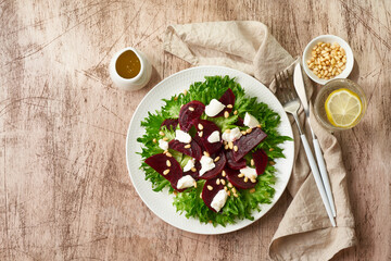 salad with beet, curd, feta, ricotta and pine nuts, lettuce. Healthy keto ketogenic dash diet