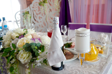 bottle of champagne, flowers, wedding