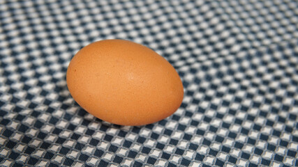 One egg on the fabric table