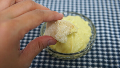 Streamed bread dips in sweet custard dip
