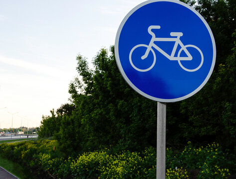 Road sign bike path. White bike icon on a blue sign circle. healthy lifestyle concept