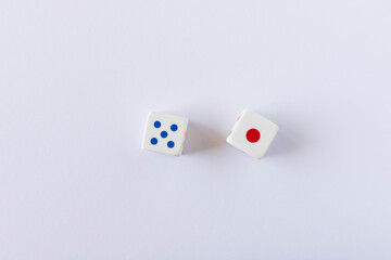 Dice on the light background. Close up. The concept of good luck in gambling.